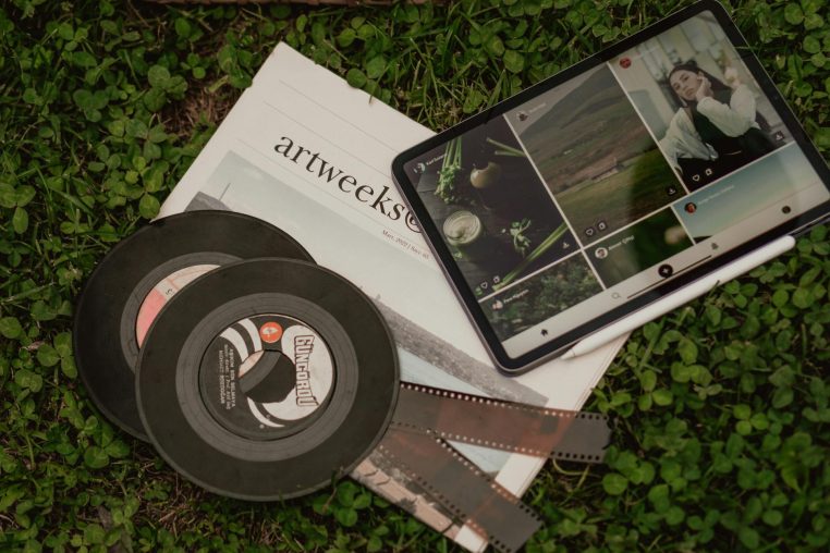 pictures on tablet on ground with disks and photographic films